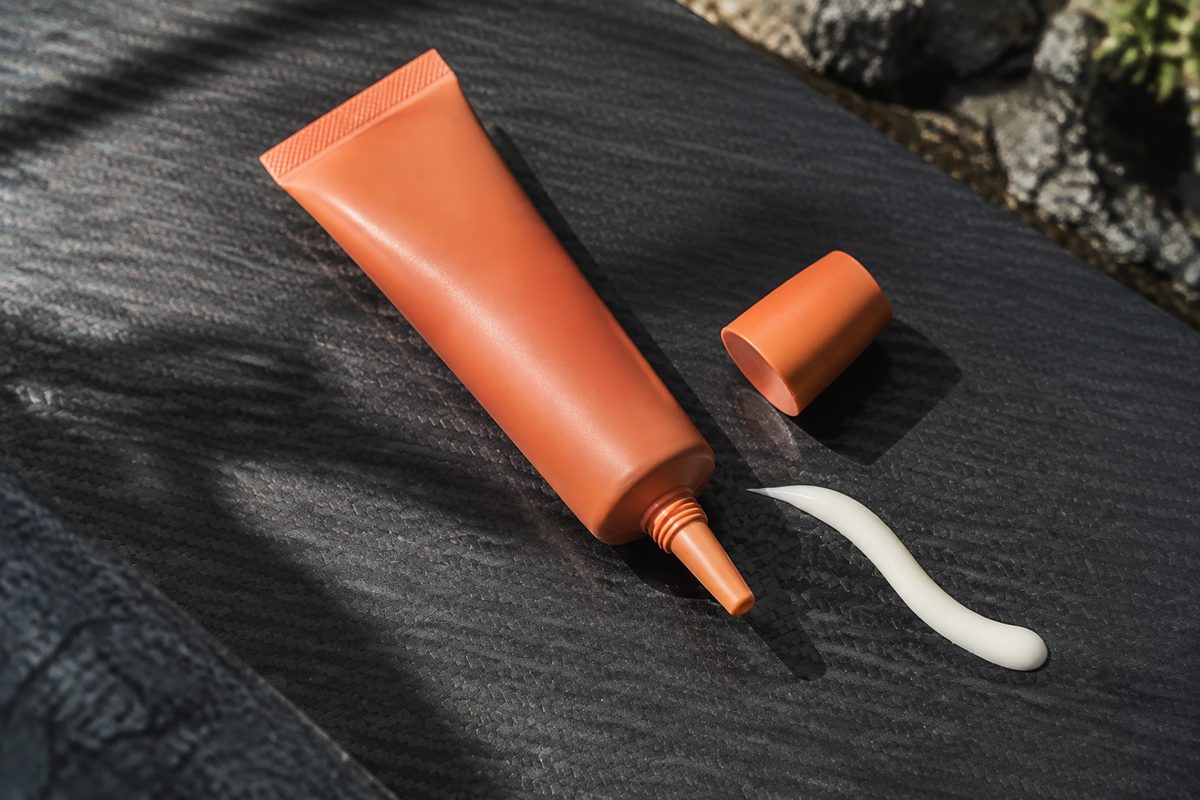 Cellular Defense Mineral SPF 50 Shield tube on carbon fiber surface
